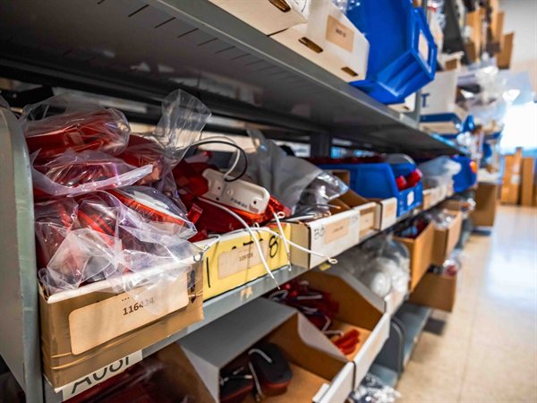 Shelves of organized, labeled bus and van replacement parts in the TESCO warehouse